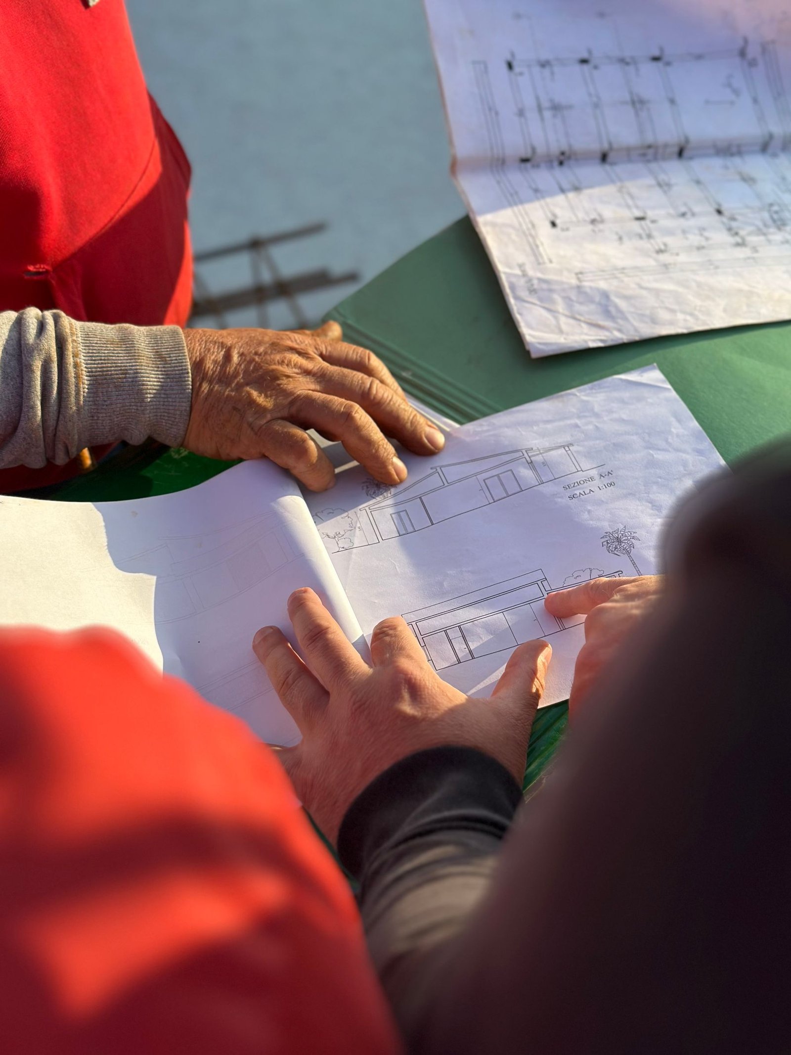 Construction professionals reviewing architectural plans together